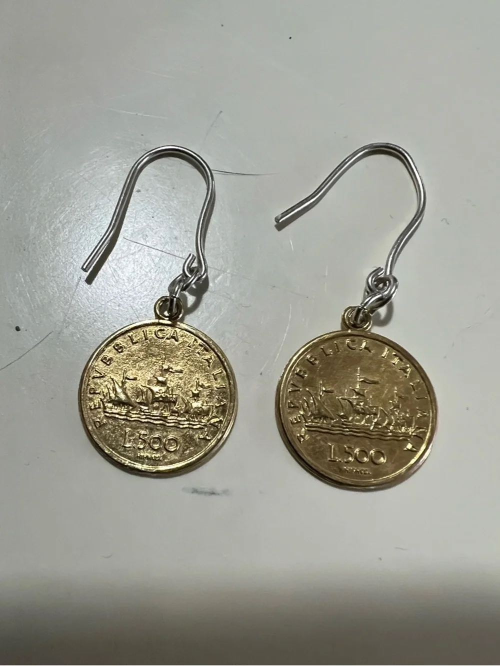 Two tone Italian 500 Lire coins on sterling silver hook earrings.